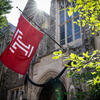 The cherry red Temple T flag waving on Main Campus